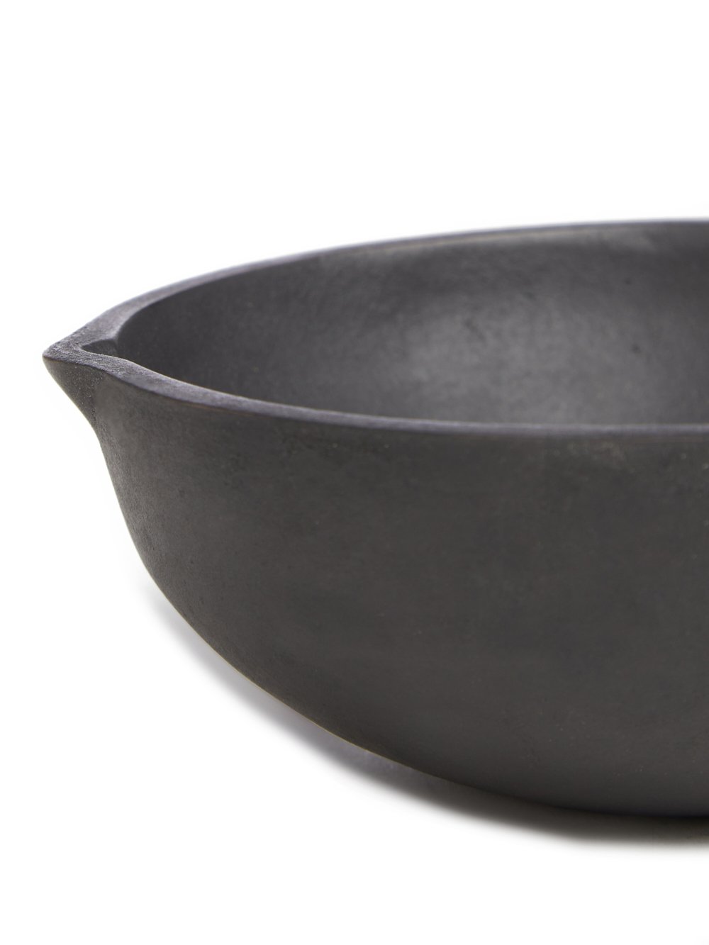 RICK OWENS BOWL HAS A ROUND SHAPE AND FEATURES A SMALL TRIANGLE DETAIL AND POLISHED SURFACE.