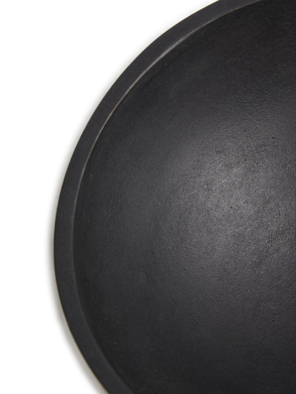 RICK OWENS BOWL HAS A ROUND SHAPE AND FEATURES A SMALL TRIANGLE DETAIL AND POLISHED SURFACE.