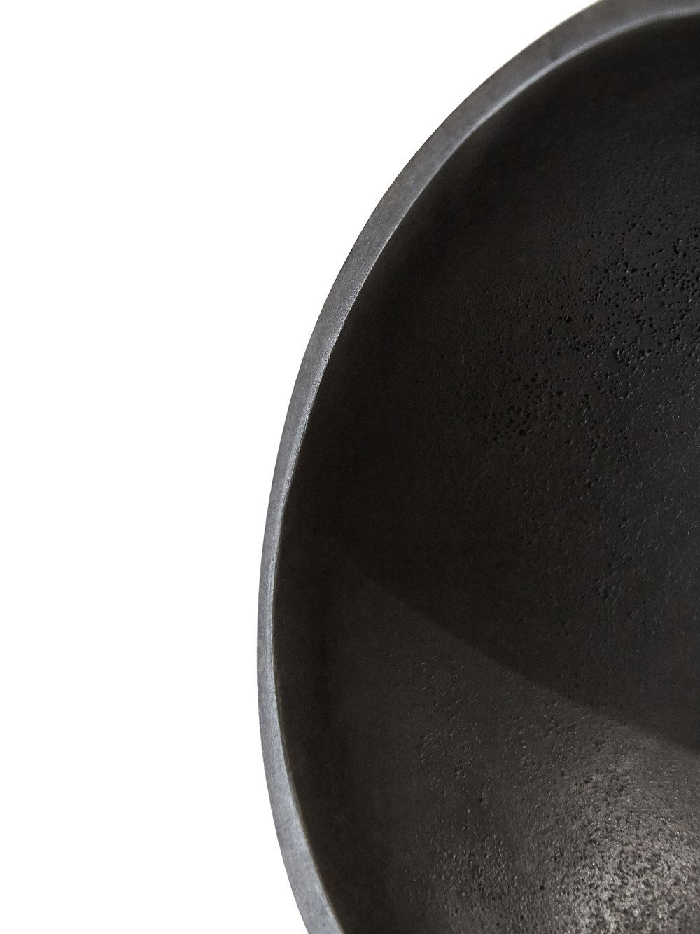 RICK OWENS BOWL HAS A ROUND SHAPE AND FEATURES A SMALL TRIANGLE DETAIL AND POLISHED SURFACE.
